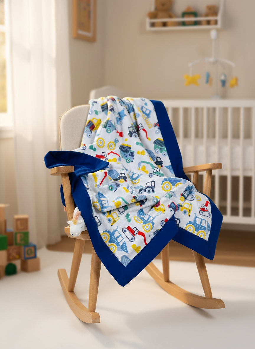 Baby blanket with vehicle pattern and blue border and backing